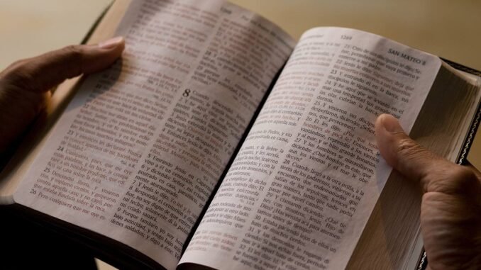 spanish-bible-anniversary-hands-umnews-2019-3500