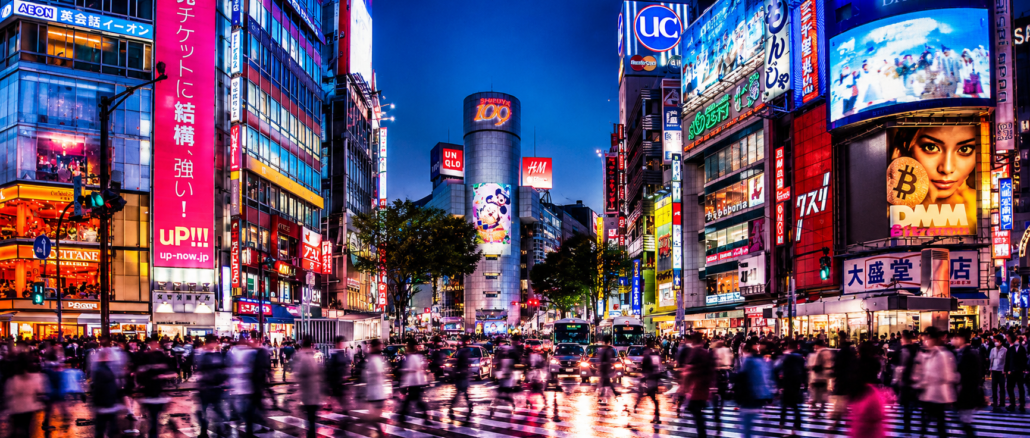 Calles iluminadas de Tokio representando el avance tecnológico y la inteligencia artificial en Japón