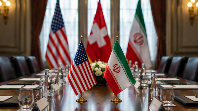 Mesa preparada para las negociaciones entre Irán y Estados Unidos en Suiza con las banderas de ambos países.